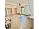 Living room featuring wood floors, a ceiling fan, natural light, and multiple closets at 3810 Galloway Dr, Roswell, GA 30075