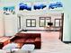 Inviting living room boasts bright art, sleek furniture, and views into a connected office space at 3810 Galloway Dr, Roswell, GA 30075