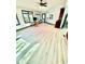 Bright living room with hardwood floors, large windows, and a custom-built desk area at 3810 Galloway Dr, Roswell, GA 30075