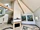 Bright living room with fireplace and exposed beams is connected to other living spaces at 3810 Galloway Dr, Roswell, GA 30075