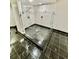 Modern tiled shower with glass doors and sleek fixtures for a spa-like experience at 3810 Galloway Dr, Roswell, GA 30075
