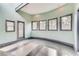 Bright sun room with curved walls, hardwood floors, and an abundance of natural light at 3810 Galloway Dr, Roswell, GA 30075