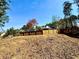 Image of the backyard space with new fencing, space for gardening and recreational activities at 4722 Bradford Ln, Powder Springs, GA 30127