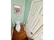 Powder room with white toilet and wood tile floor at 4722 Bradford Ln, Powder Springs, GA 30127