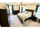 Bedroom with dark furniture, ceiling fan and natural light at 4722 Bradford Ln, Powder Springs, GA 30127