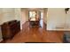 Spacious dining room featuring wood floors, traditional furniture, wainscotting, and plenty of room for entertaining at 4722 Bradford Ln, Powder Springs, GA 30127