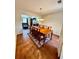 Well lit formal dining room with dark wood floors, traditional furniture, and wainscotting at 4722 Bradford Ln, Powder Springs, GA 30127