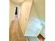 View of a carpeted hallway with view of doorway and stairs at 4722 Bradford Ln, Powder Springs, GA 30127