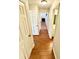 Hallway with tile floors leads to bathroom with a large mirror at 4722 Bradford Ln, Powder Springs, GA 30127