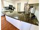 Granite countertops and stainless steel faucet enhance this kitchen's beauty at 4722 Bradford Ln, Powder Springs, GA 30127
