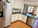 Kitchen showcasing stainless steel appliances, granite countertops, and an eat-in breakfast area at 4722 Bradford Ln, Powder Springs, GA 30127