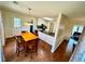Eat-in kitchen featuring granite counters, stainless appliances, a breakfast area, and dark wood floors at 4722 Bradford Ln, Powder Springs, GA 30127