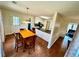 A cozy kitchen featuring an eat-in area, stainless steel appliances, and access to outdoor spaces at 4722 Bradford Ln, Powder Springs, GA 30127