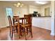 Eat-in kitchen featuring granite counters, stainless appliances, a breakfast area, and dark wood floors at 4722 Bradford Ln, Powder Springs, GA 30127