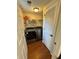 Laundry room with washer and dryer and storage shelves at 4722 Bradford Ln, Powder Springs, GA 30127