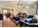 Open-concept living room with a view into the dining area, wood floors, and comfortable seating at 4722 Bradford Ln, Powder Springs, GA 30127