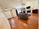 Living room showcases a fireplace, wood floors, an area rug, and open floor plan at 4722 Bradford Ln, Powder Springs, GA 30127