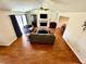 Spacious living room featuring wood flooring, fireplace, and vaulted ceiling at 4722 Bradford Ln, Powder Springs, GA 30127