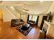 Inviting living room with fireplace, hardwood floors, and a staircase leading to the upper level at 4722 Bradford Ln, Powder Springs, GA 30127