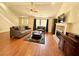 Bright living room featuring hardwood floors, fireplace, and plenty of natural light at 4722 Bradford Ln, Powder Springs, GA 30127