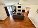 Bright and airy living room showcasing wood floors, a fireplace, and contemporary furnishings at 4722 Bradford Ln, Powder Springs, GA 30127