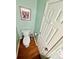 This tidy toilet is in a room with light-green walls and wood-style flooring at 4722 Bradford Ln, Powder Springs, GA 30127