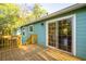 Back deck with stairs and sliding glass doors on a sunny day at 5030 Sumit Wood Dr, Kennesaw, GA 30152