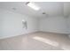 Spacious basement featuring tiled flooring, white walls, and a window at 5030 Sumit Wood Dr, Kennesaw, GA 30152