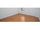 Bedroom with hardwood floors, baseboard trim, a window and a door to the hall at 5030 Sumit Wood Dr, Kennesaw, GA 30152