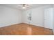 Bedroom with hardwood floors, a window, and a closet door at 5030 Sumit Wood Dr, Kennesaw, GA 30152