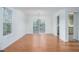 Bright dining area with hardwood floors, white walls, and a sliding glass door leading to outdoor area at 5030 Sumit Wood Dr, Kennesaw, GA 30152
