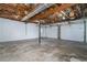 Spacious garage featuring two bays, exposed ceiling, and concrete flooring at 5030 Sumit Wood Dr, Kennesaw, GA 30152