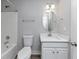 Bathroom with an oval mirror over a vanity and a combined shower and bathtub at 5848 Dunn Sw Rd, Mableton, GA 30126