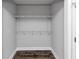 A walk in closet includes built-in shelving and wood look flooring at 5848 Dunn Sw Rd, Mableton, GA 30126