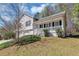 Quaint home featuring a covered front porch, two-car garage, and a cozy curb appeal at 5848 Dunn Sw Rd, Mableton, GA 30126
