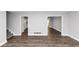 Spacious living area boasting vinyl floors, leading into kitchen and dining room at 5848 Dunn Sw Rd, Mableton, GA 30126