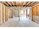 Unfinished basement featuring exposed brick walls, visible beams, and a concrete floor with natural light at 955 Bouldercrest Se Dr, Atlanta, GA 30316