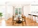 Dining area featuring a modern table, chairs, and chandelier, with kitchen access at 955 Bouldercrest Se Dr, Atlanta, GA 30316