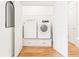 Convenient laundry room with new side-by-side washer and dryer and built-in storage sits behind double doors at 955 Bouldercrest Se Dr, Atlanta, GA 30316
