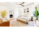 Spacious main bedroom with ensuite bathroom features bright light and hardwood floors at 955 Bouldercrest Se Dr, Atlanta, GA 30316