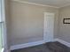 Bedroom featuring neutral walls, carpet, and natural light, ideal for a restful retreat at 1012 Burns Dr, Atlanta, GA 30310