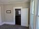 Bedroom showing light-filled room with door, window, and carpet, creating calm, comfortable space at 1012 Burns Dr, Atlanta, GA 30310