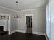 Bright dining area featuring dark wood floors and classic chandelier, ideal for comfortable living at 1012 Burns Dr, Atlanta, GA 30310