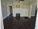 Living room with dark-toned flooring and fireplace, showcasing a cozy and inviting atmosphere at 1012 Burns Dr, Atlanta, GA 30310