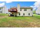 A spacious backyard features a deck and ample space for outdoor activities and gatherings at 1395 Brisbane Dr, Dacula, GA 30019