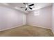 Bedroom featuring carpet, a ceiling fan, a window, neutral paint and a closet at 1395 Brisbane Dr, Dacula, GA 30019