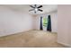 Bedroom featuring carpet, a ceiling fan, a window, and neutral paint at 1395 Brisbane Dr, Dacula, GA 30019