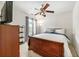 Bedroom with bed, dresser, ceiling fan, and window with curtains at 1395 Brisbane Dr, Dacula, GA 30019
