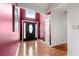 Bright entryway with hardwood floors, transom window, and a stylish front door with decorative glass at 1395 Brisbane Dr, Dacula, GA 30019