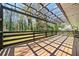 Spacious wooden deck with a pergola overlooking a lush, green backyard area at 1755 Fairburn Sw Rd, Atlanta, GA 30331